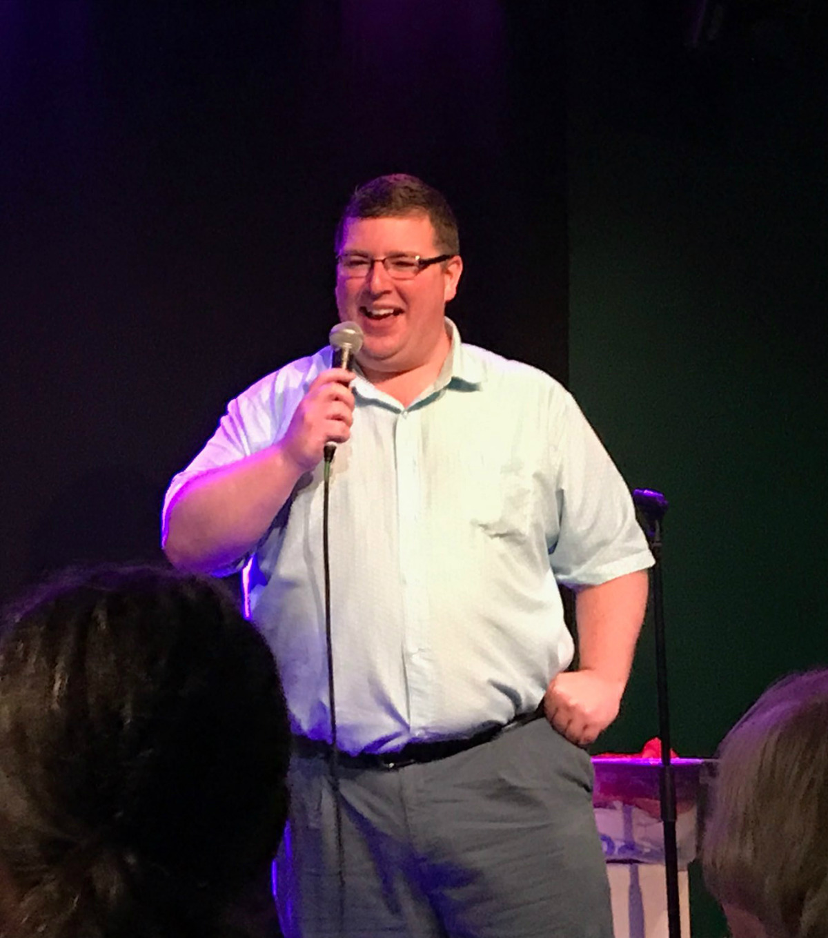 "Dr Lowe on stage with a microphone"