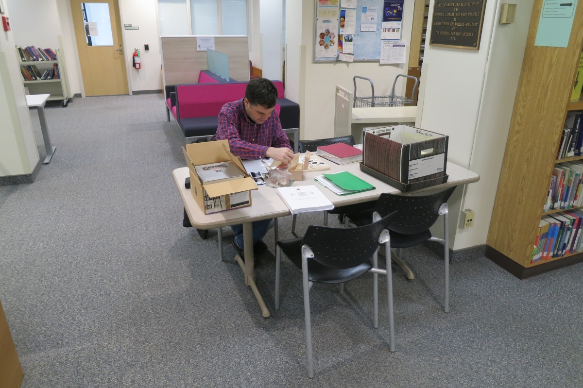 "Miguel analysing records"